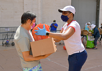 People handing food to each other