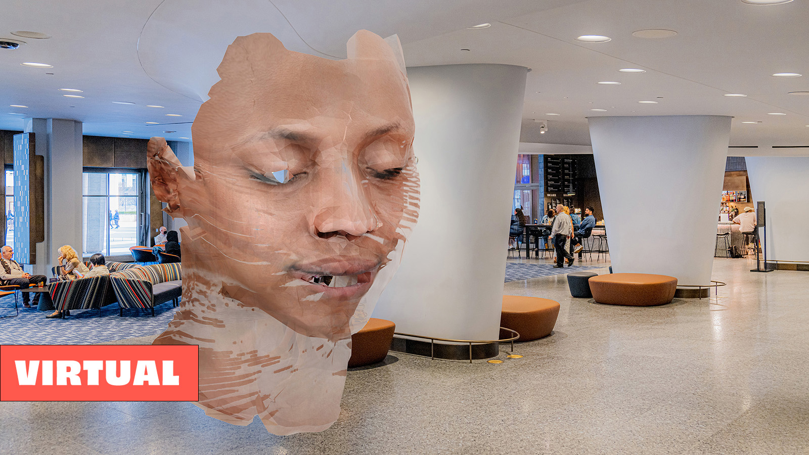  A photo of the lobby of David Geffen Hall with a floor-to-ceiling augmented reality bust of a distorted face composed of light skin tones in the center.